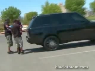 Blonde milf sucks on a ebony boner thereafter being picked up in a petting lot
